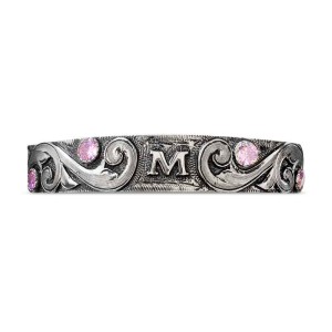 A silver cuff bracelet for men and women featuring a personalized initials and scrollwork 