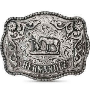 A custom western belt buckle for men featuring a personalized praying cowboy figure built on a hand engraved antiqued german silver base 