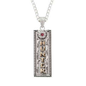 A custom name tag pendant necklace featuring a rectangular shape and golden lettering, with a sterling silver chain