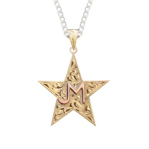 A custom pendant necklace featuring a golden star shape, a copper personalized ranch brand, with a sterling silver chain 