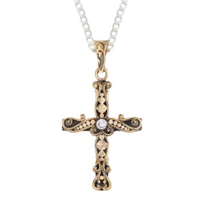 A custom bronze cross pendant necklace for men and women, western-inspired design. featuring bronze dots and a white zirconia stone