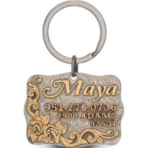 A custom dog tag with personalized engraved bronze lettering built on a german silver base, featuring a golden roses, western designed