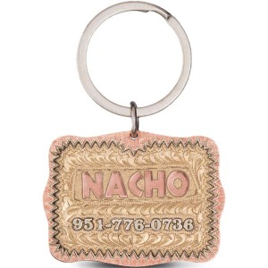 A custom dog tag with personalized engraved copper lettering built on a copper base, western designed 