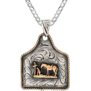 A custom cow tag pendant necklace built on a hand engraved silver base with a praying cowboy figure in the center