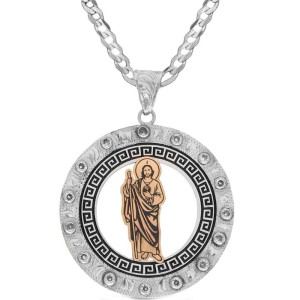 A custom pendant necklace built on a hand engraved silver base in a circle shape with a San Judas Tadeo figure in the center