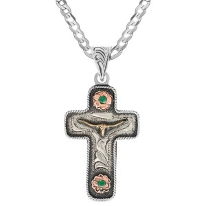 A custom pendant necklace built on a hand engraved silver base in a cross shape with a longhorn figure in the center