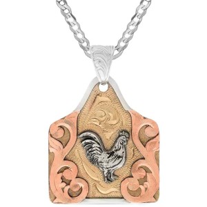 A custom cow tag pendant necklace built on a hand engraved bronze base with a silver rooster  figure in the center